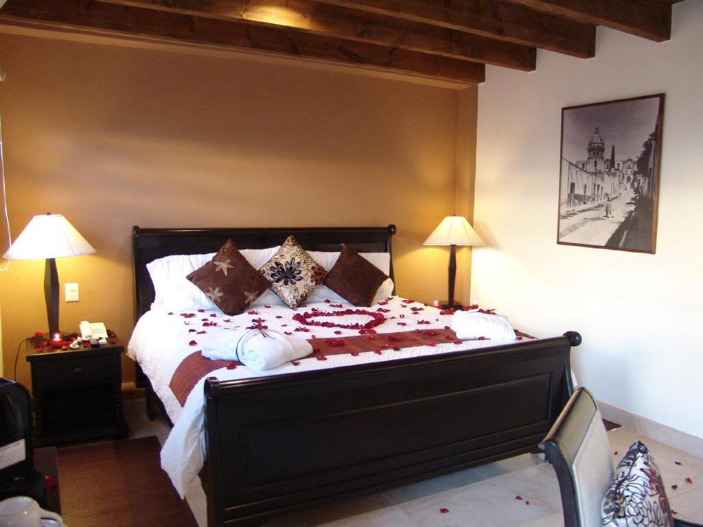 提欧精品酒店 圣米格尔－德阿连德 客房 照片 A bedroom at the Inn at the Quinta Real